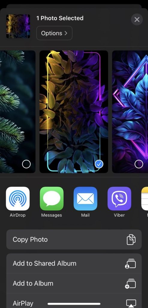 Tap the Share icon in the Photos app on iPhone